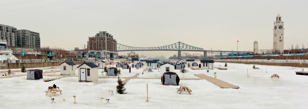 Ice fishing in Montreal downtown, on the st-Lawrence river during winter.