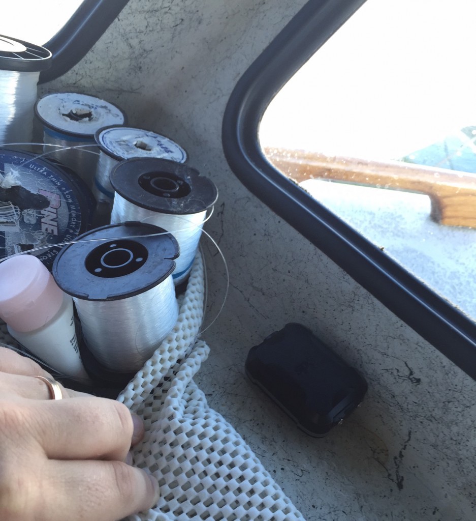 The SPOT Trace is placed on my boat on the dash near a window, out of sight behind some spools of line.