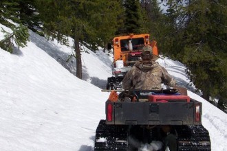 York Outfitters taking clients on a hunt in the Bitterroot Selway Wilderness on 4wd vehicles and their snow groomer