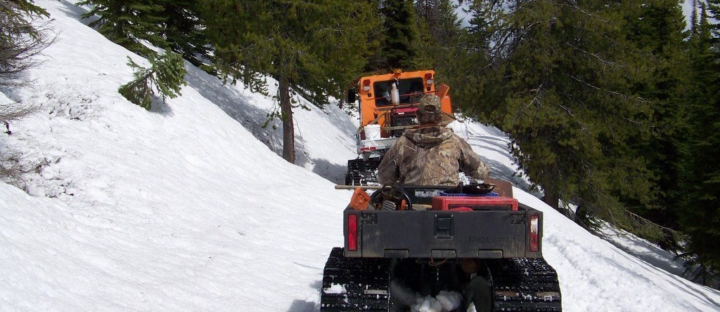 York Outfitters taking clients on a hunt in the Bitterroot Selway Wilderness on 4wd vehicles and their snow groomer
