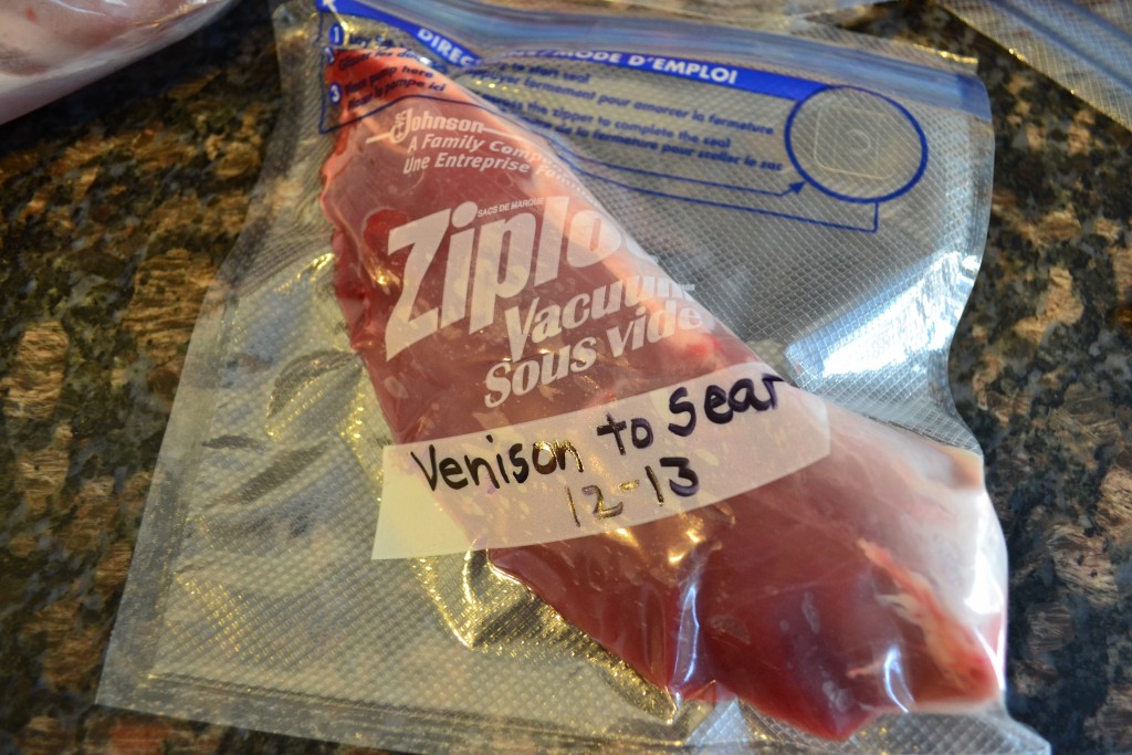 Venison loin frozen in a ziplock freezer vacuum bag