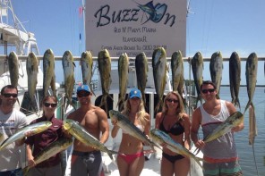 happy customers after a day of fishing with captain aaron brower on the buzz on in islamorada florida
