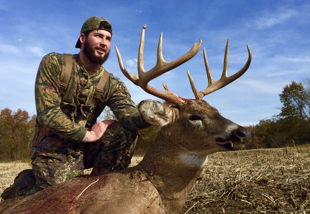 RackNine photo featuring a happy client who has harvested a mature buck