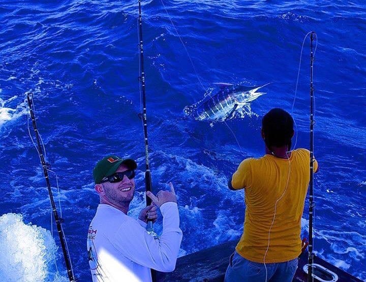 A happy Stuart Big Game Fishing client landing a marlin