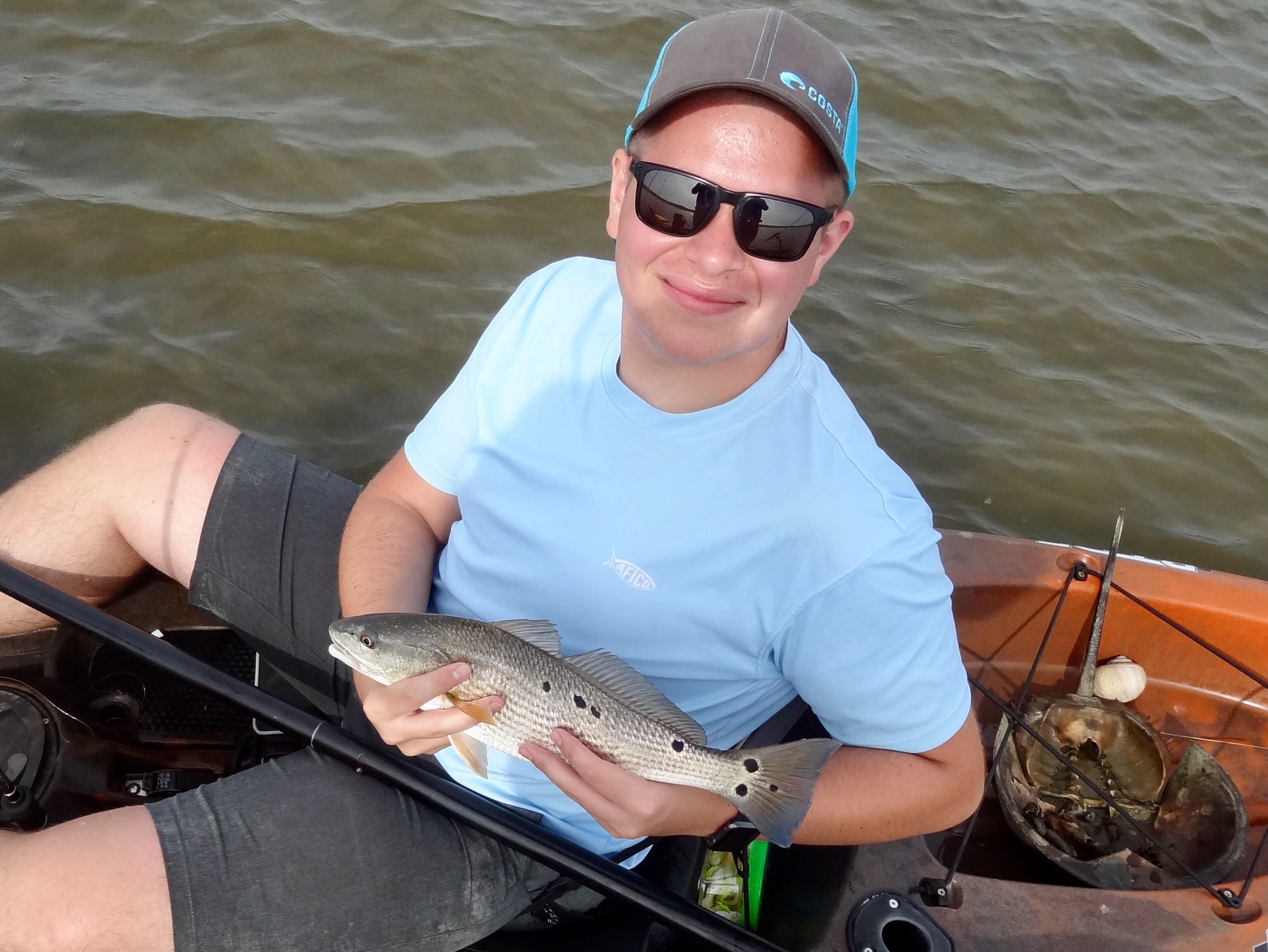 Jacob With a Red while Kayak Fishing