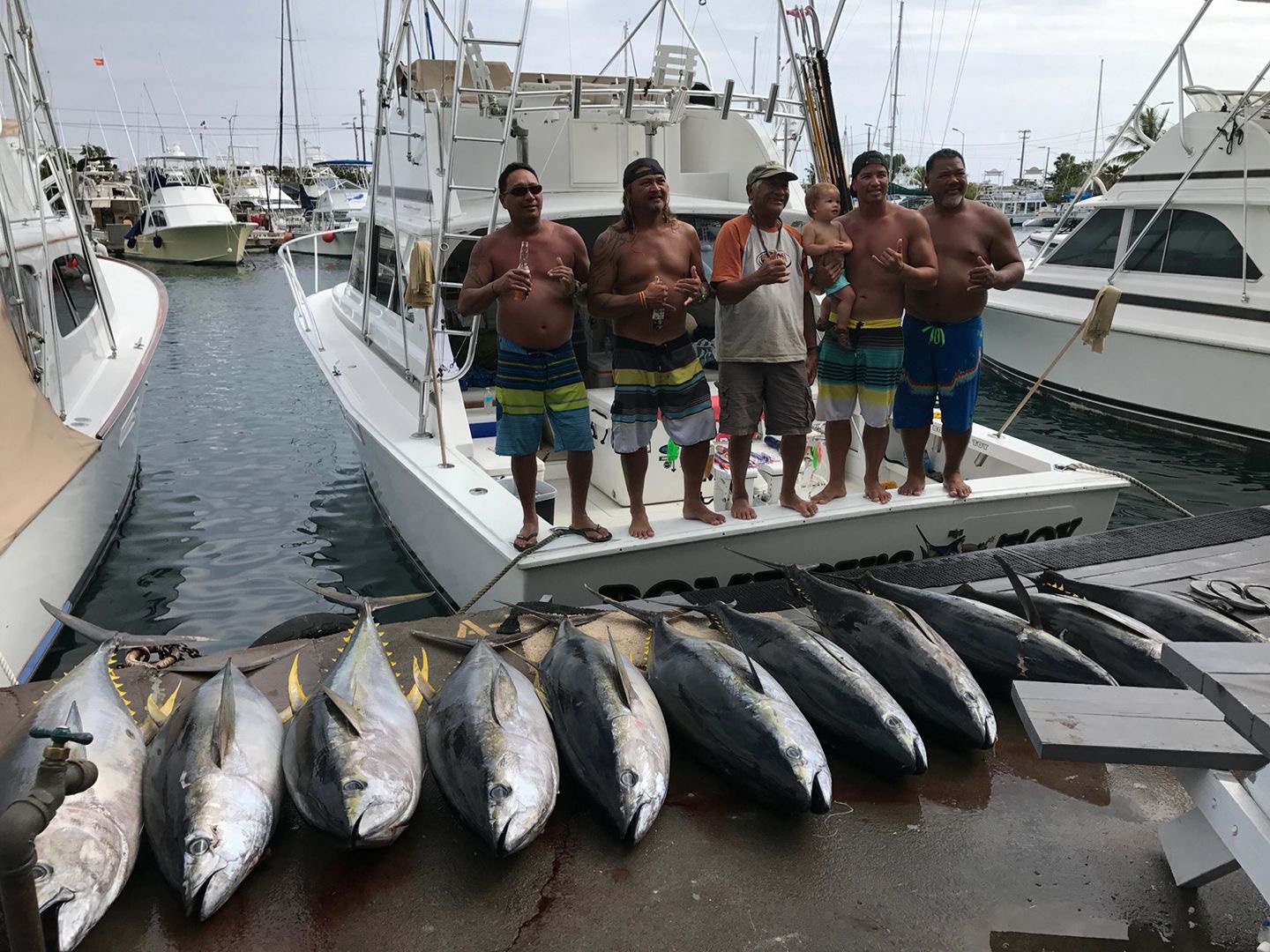 Captain Bomboy Llanes Charters with a pile of tuna